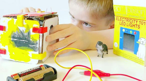 little boy learning circuits and LED lighting with 3DuxDesign Power pack kit