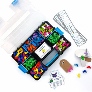 3DuxDesign GoBox classroom STEM kit featuring the unique 3DuxDesign connector system, cardboard building pieces, and student engineering models